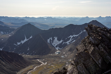The concept of outdoor activities in the mountains. Minimalist mountain landscape. Atmospheric view. The majestic nature of the Circumpolar Urals.