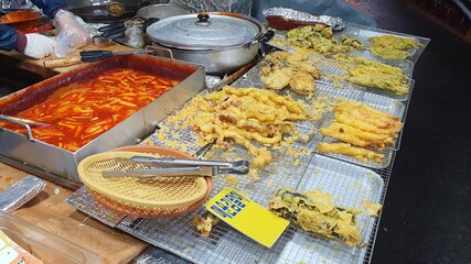 Korean street food stall in Seoul myungdong. A popular tourist destination in korea. Spicy rice cake and fries.