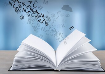 Open book with letters flying away. Education concept