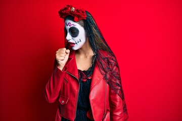 Woman wearing day of the dead costume over red feeling unwell and coughing as symptom for cold or bronchitis. health care concept.