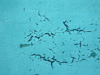 abstract texture turquoise background with cracks and craquelure