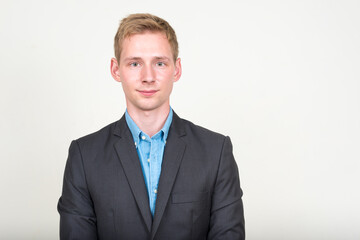 Portrait of young handsome blond businessman in suit