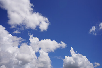Naklejka na ściany i meble White clouds on blue sky.