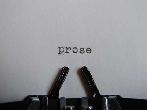 the word "prose" typed on a typewriter, close up