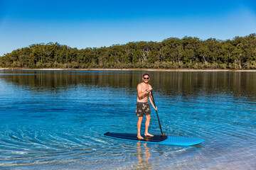 Stand up paddle boarding  on Lake Mckenzie, Fraser Island