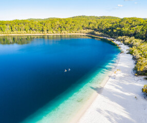 Couple stand up paddle boarding  on Lake Mckenzie