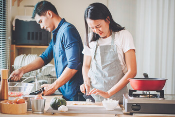 people preparing and cooking food in the home kitchen