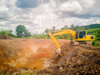 Backhoe digging a pool