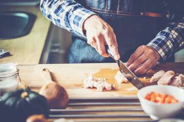 people preparing and cooking food in the home kitchen