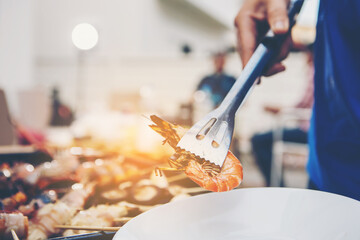 people preparing and cooking food in the home kitchen