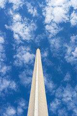 Obraz na płótnie Canvas the concrete spire of the antenna rises up against the blue sky