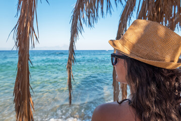 Woman relaxing at a beach.