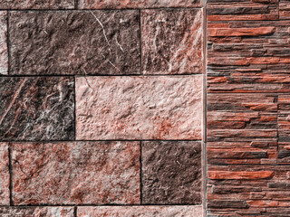 Texture of artificial stone. Stone fence. Wall in the park.