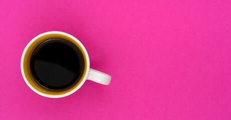 Top view, flat lay of black coffee cup on background pink.
