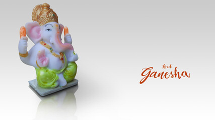 Lord Ganesha idol isolated in white background