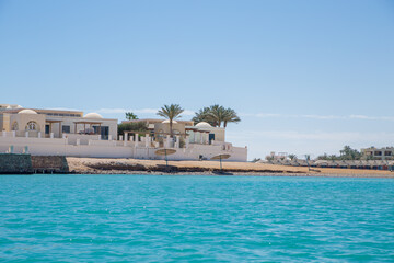 Naklejka premium sea beach with palms and houses in egypt