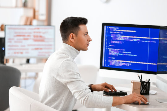 Male programmer working in office