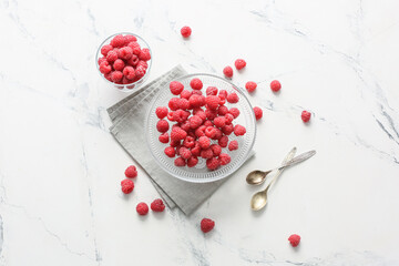 Tasty ripe raspberries on white background