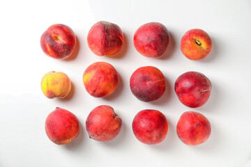 Sweet ripe peaches on white background