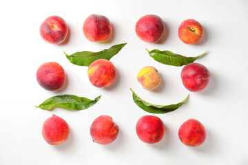 Sweet ripe peaches on white background