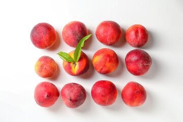 Sweet ripe peaches on white background