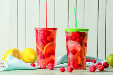 Glasses of cold raspberry tea on table