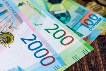 Russian 200 rubles close-up on a wooden table,