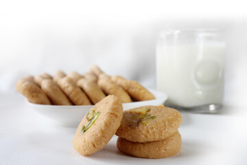 Milk peda is a traditional Indian sweet made from milk or khoya and garnished with pistachio to celebrate festivals like Diwali.