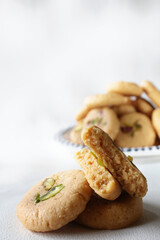 Milk peda is a traditional Indian sweet made from milk or khoya and garnished with pistachio to celebrate festivals like Diwali.