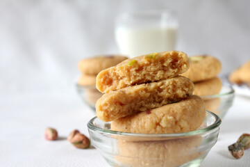 Milk peda is a traditional Indian sweet made from milk or khoya and garnished with pistachio to celebrate festivals like Diwali.