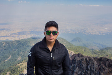 mid adult mountaineer smiling from the Malinche mountains, portrait.Copy space