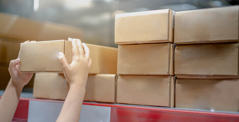 Female hand choosing the box of furniture for self-servive and built-in in house