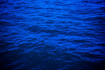 dark deep blue sea water surface background. Backdrop design for art work or add text message.