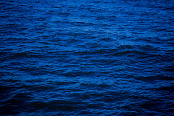 dark deep blue sea water surface background. Backdrop design for art work or add text message.