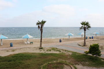 Landscape of sea with umbrellas and chairs