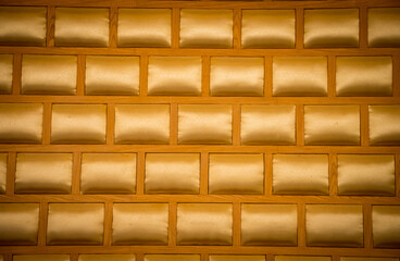 Elegant saturated glossy gold leather texture of wall