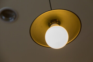 Lamp hanging on a gray wall background