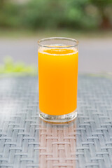 Orange juice with bokeh nature