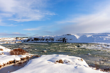 Picturesque winter landscape view of Urridafoss waterfall in Iceland.