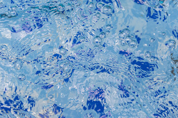 Clear and clean water in the blue swimming pool
