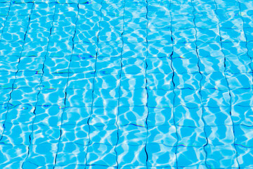 Blue ripe water reflection in swimming pool