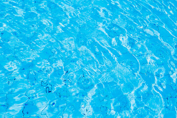 Blue ripe water reflection in swimming pool