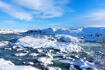 Picturesque winter landscape view of Urridafoss waterfall in Iceland.