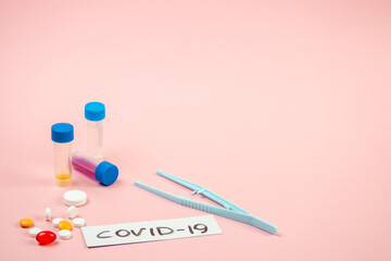 Covid-19, medical instruments, syringe and colorful medicines