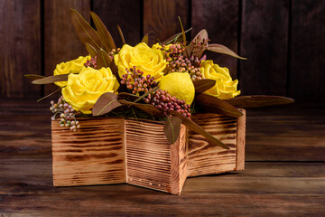Bouquet of beautiful bright yellow rose flowers in a gift box