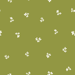 Cute simple floral seamless vector patterns with white small flowers on green background for fabric, wallpaper, scrapbooking projects or backgrounds.