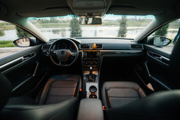 Obraz na płótnie Canvas Black interior of a business class car close-up. Car