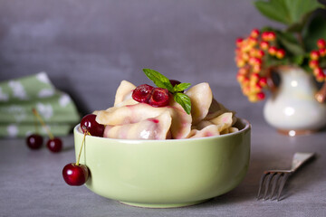 Dumplings, filled with cherries. Varenyky, vareniki, pierogi, pyrohy - dumplings with filling