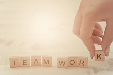 Alphabet Team work on old white vintage wood