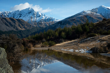 Fototapeta na wymiar View of the mountain and reflections in winter from the Queenstown Hill Walkway track